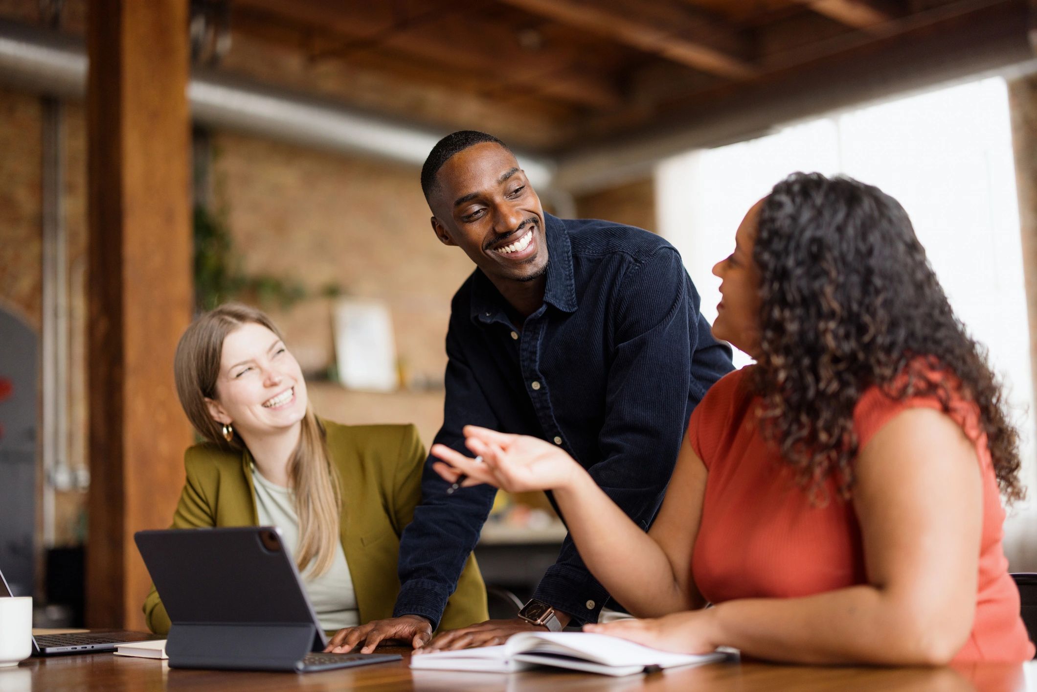 Business professional in conversation during office meeting