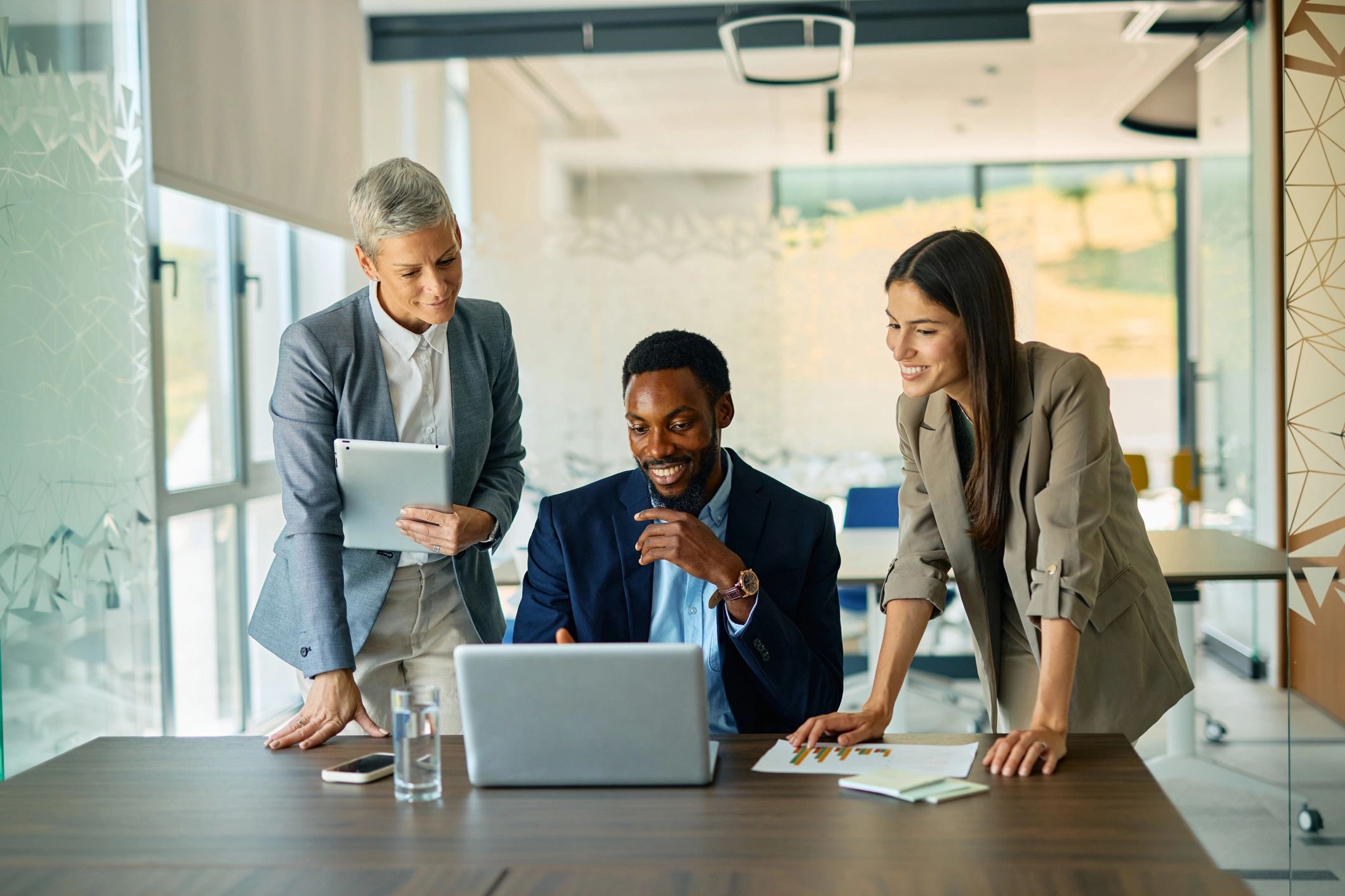 Consultants collaborating on strategy in a modern office
